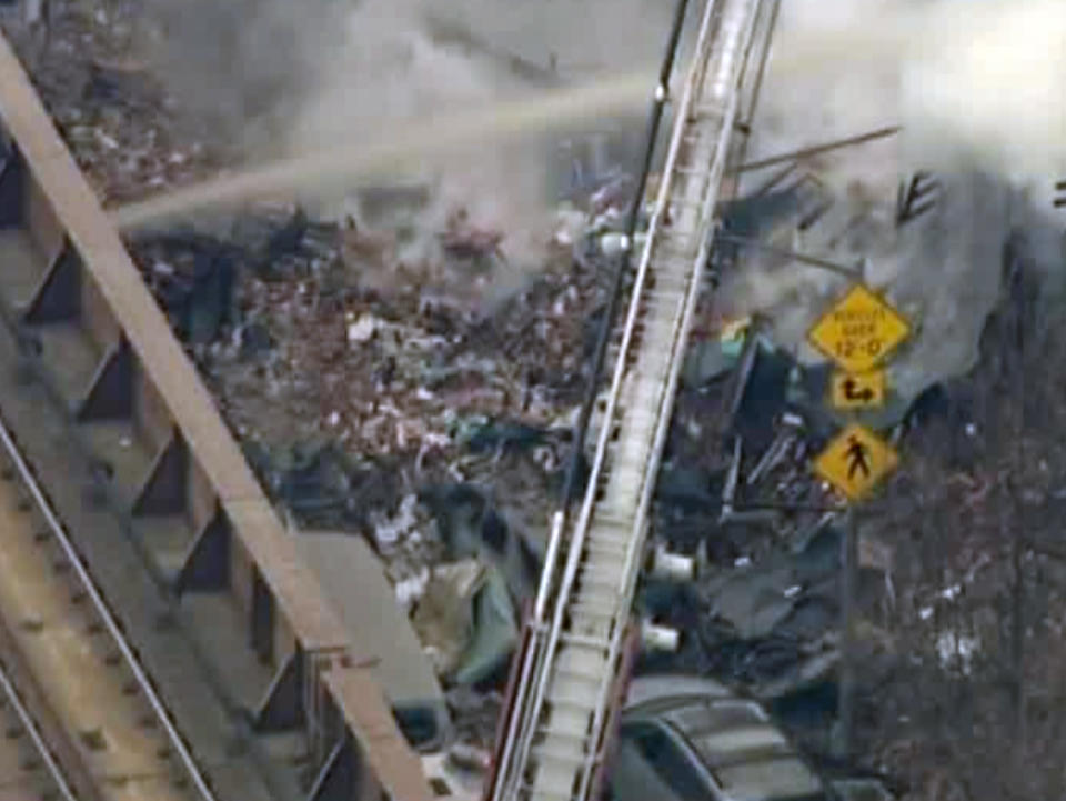 In this image taken from video from WABC, firefighters battle a blaze at the site of a possible explosion and building collapse in the East Harlem neighborhood of New York, Wednesday, March 12, 2014. (AP Photo/WABC-TV)