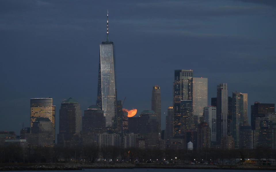 JERSEY CITY, NJ - JANUARY 10: The full Wolf Moon rises behind the skyline of lower Manhattan in New York City on January 10, 2020 as seen from Jersey City, New Jersey. (Photo by Gary Hershorn/Corbis via Getty Images)