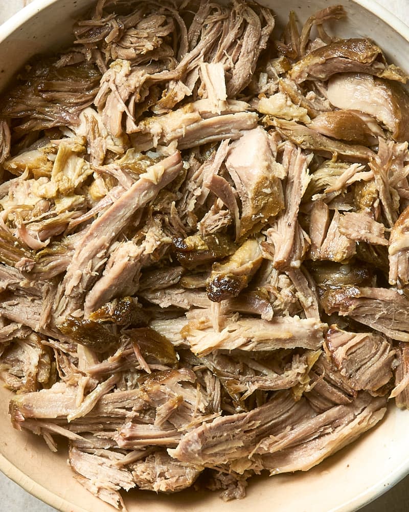 overhead shot of carnitas in a large pot