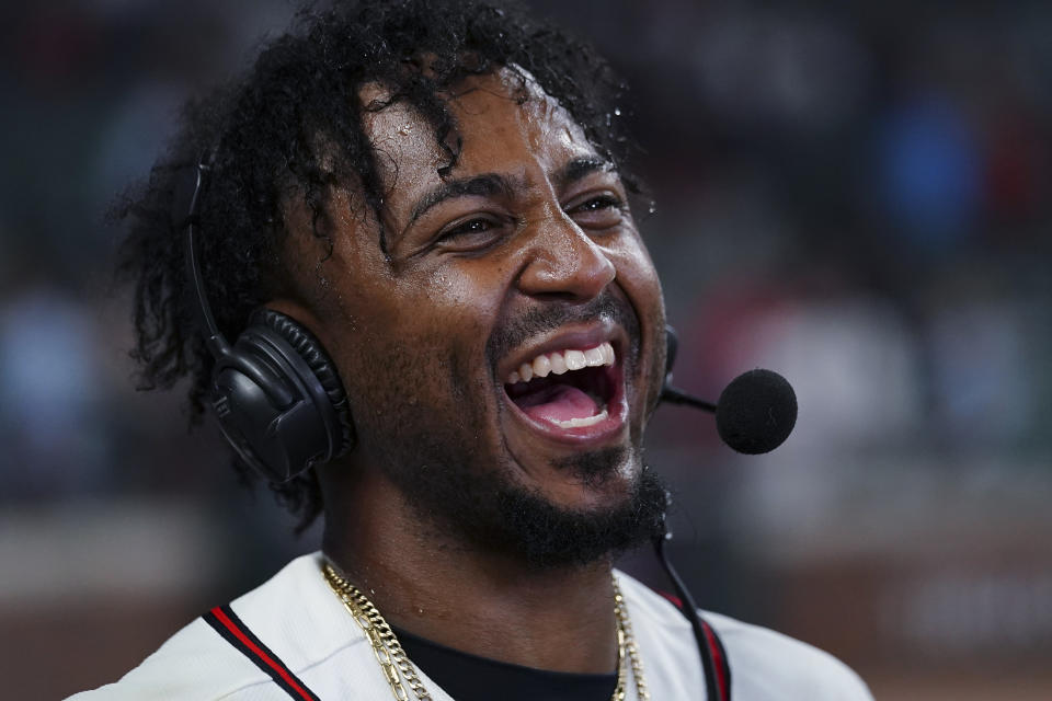 CORRECTS TO THREE-RUN HOME RUN, NOT TWO-RUN - Atlanta Braves' Ozzie Albies laughs as he is interviewed after hitting the game-winning, three-run home run against the New York Mets during the 10th inning of a baseball game Thursday, June 8, 2023, in Atlanta. (AP Photo/John Bazemore)
