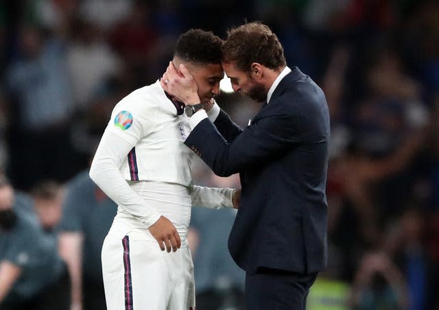 England manager Gareth Southgate consoles Jadon Sancho following defeat in the penalty shoot-out to Italy in the Euro 2020 final