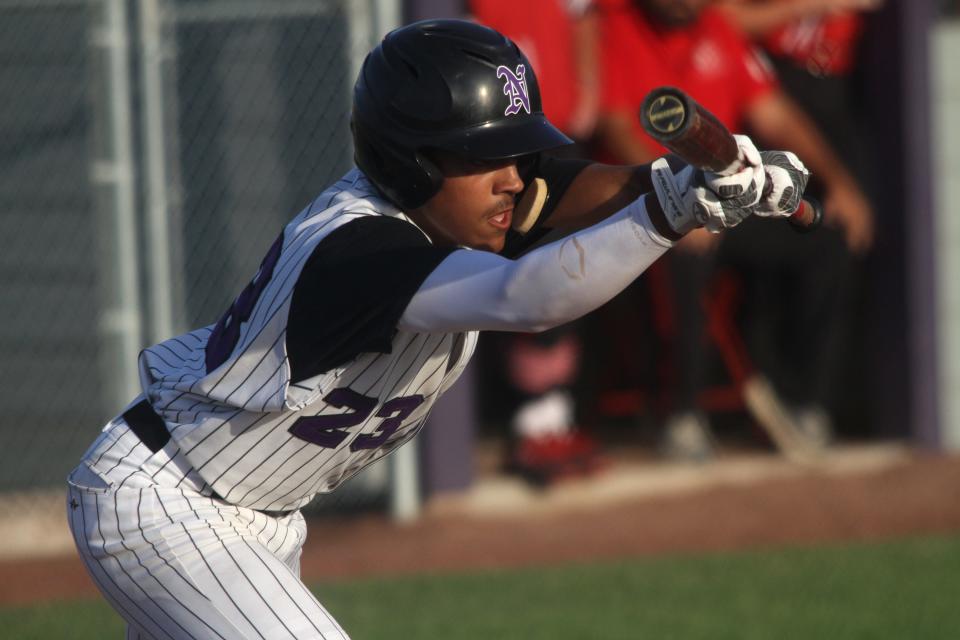 Norwalk junior Ryan Wood squares to bunt. Norwalk beat Centerville 4-1 at home on July 22 to earn a Class 3A state tournament berth. 