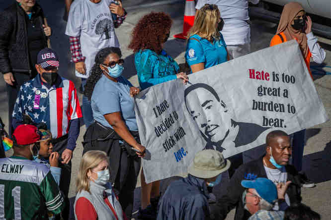 Nova Southeastern University students from the Student National Medical Association carried signage in the parade along North Federal Highway during a Martin Luther King, Jr., Day parade in Boca Raton, Fla., on Monday, January 17, 2022.