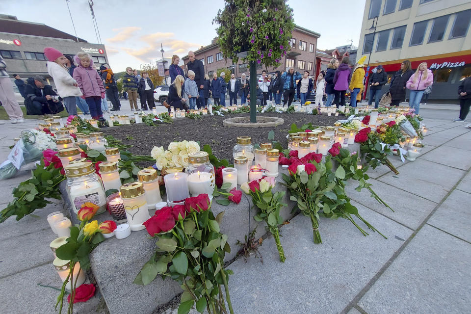 Flowers and candles are placed at a memorial after a man killed several people on Wednesday afternoon, in Kongsberg, Norway, Thursday, Oct. 14, 2021. The bow-and-arrow rampage by a man who killed five people in a small town near Norway's capital appeared to be a terrorist act, authorities said Thursday, a bizarre and shocking attack in a Scandinavian country where violent crime is rare. Police identified the attacker as Espen Andersen Braathen, a 37-year-old Danish citizen, who was arrested on the street Wednesday night. (AP Photo/Pal Nordseth)