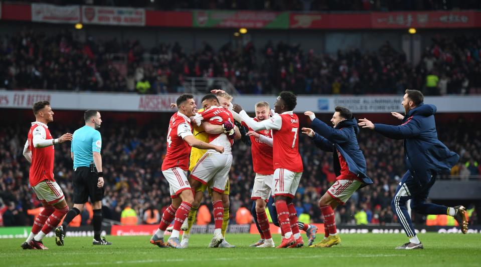   Arsenal players and staff celebrate on the pitch after Reiss Nelson scored their team's third goal during the Premier League match between Arsenal and AFC Bournemouth at the Emirates Stadium on March 4, 2023 in London, United Kingdom. 