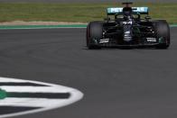 <p>Mercedes' British driver Lewis Hamilton steers his car during the qualifying session for the Formula One British Grand Prix at the Silverstone motor racing circuit in Silverstone, central England on August 1, 2020.</p>