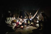 The Torres Izquierdo, an Arhuaco Indigenous family, gathers at their home in Nabusimake on the Sierra Nevada de Santa Marta, Colombia, Monday, Jan. 16, 2023. Not all in the Torres Izquierdo family speaks Spanish, but all speak Iku, their own native Arhuaco language. (AP Photo/Ivan Valencia)