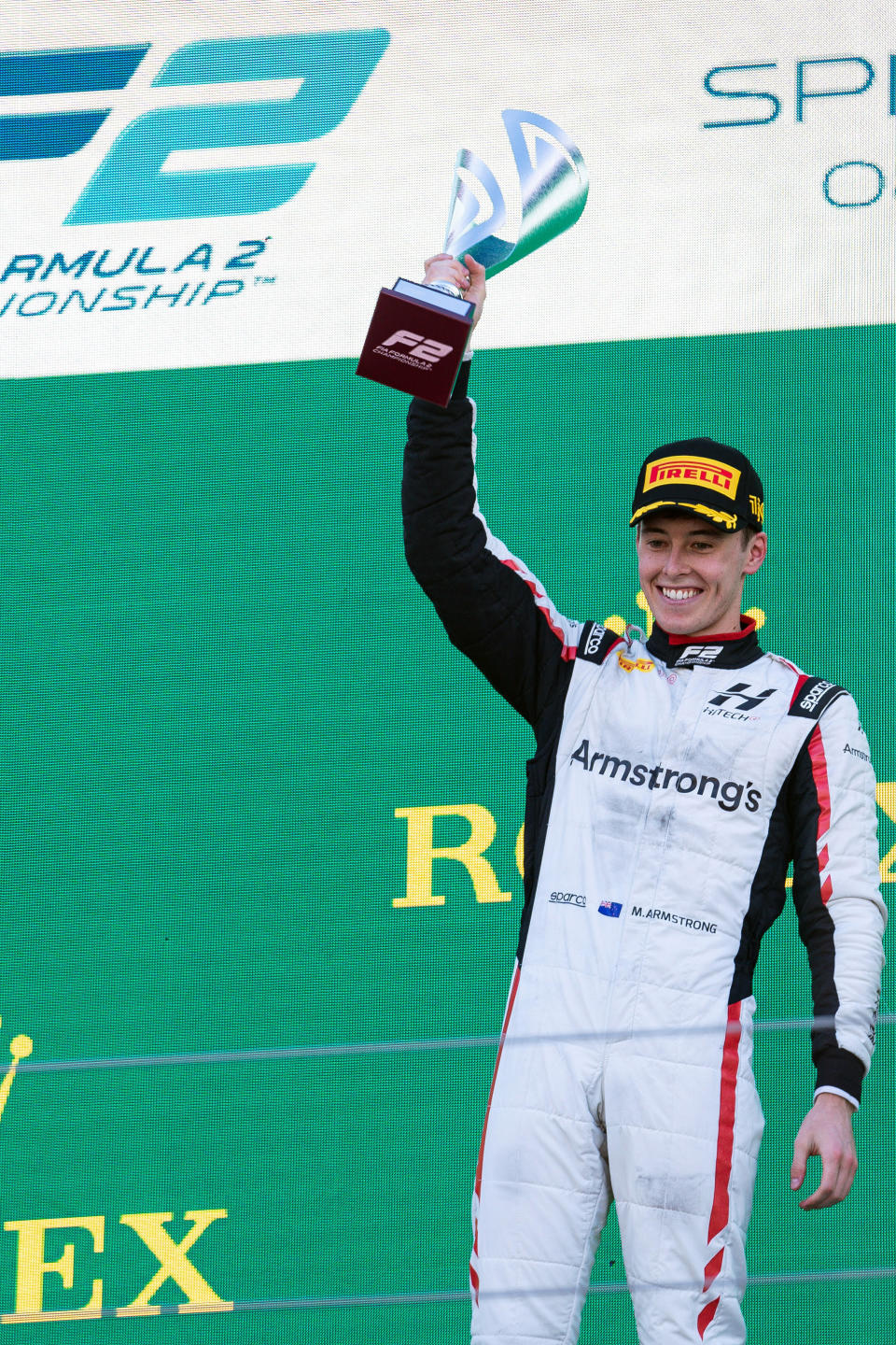 In this photo provided by James Gasperotti, New Zealand driver Marcus Armstrong celebrates after winning a Formula 2 sprint race at the Enzo and Dino Ferrari racetrack, in Imola, Italy, April 23, 2022. Chip Ganassi Racing has signed New Zealand driver Marcus Armstrong to join its IndyCar lineup next season. (James Gasperotti via AP)