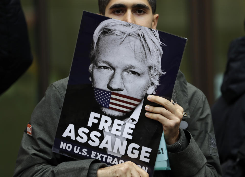 Supporters of Wikileaks founder Julian Assange demonstrate outside Westminster Magistrates' Court in London where Assange is expected to appear as he fights extradition to the United States on charges of conspiring to hack into a Pentagon computer, in London, Monday Oct. 21, 2019. U.S. authorities accuse Assange of scheming with former Army intelligence analyst Chelsea Manning to break a password for a classified government computer. (AP Photo/Kirsty Wigglesworth)