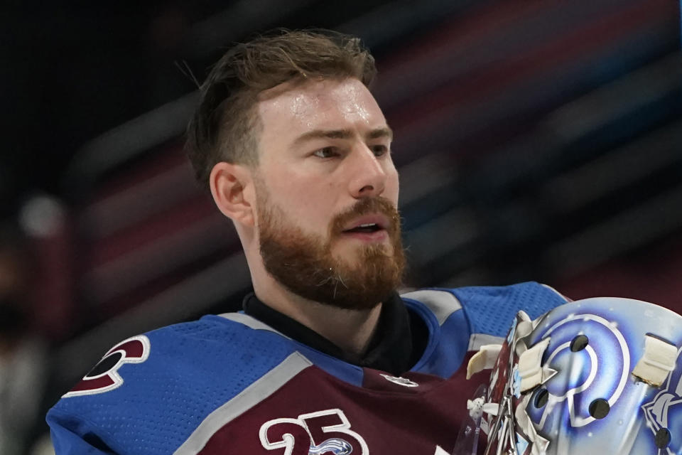 FILE - Colorado Avalanche goaltender Philipp Grubauer (31) is shown in the first period of an NHL hockey game against the San Jose Sharks in Denver, in this Friday, April 30, 2021, file photo. This was an unprecedented offseason of goaltender movement around the NHL. Vegas traded Vezina Trophy winner Marc-Andre Fleury to Chicago. Finalist Philipp Grubauer couldn't agree to a deal with Colorado and signed with expansion Seattle in free agency. And those moves set off a domino effect that included 25 different goalies changing teams. (AP Photo/David Zalubowski, File)