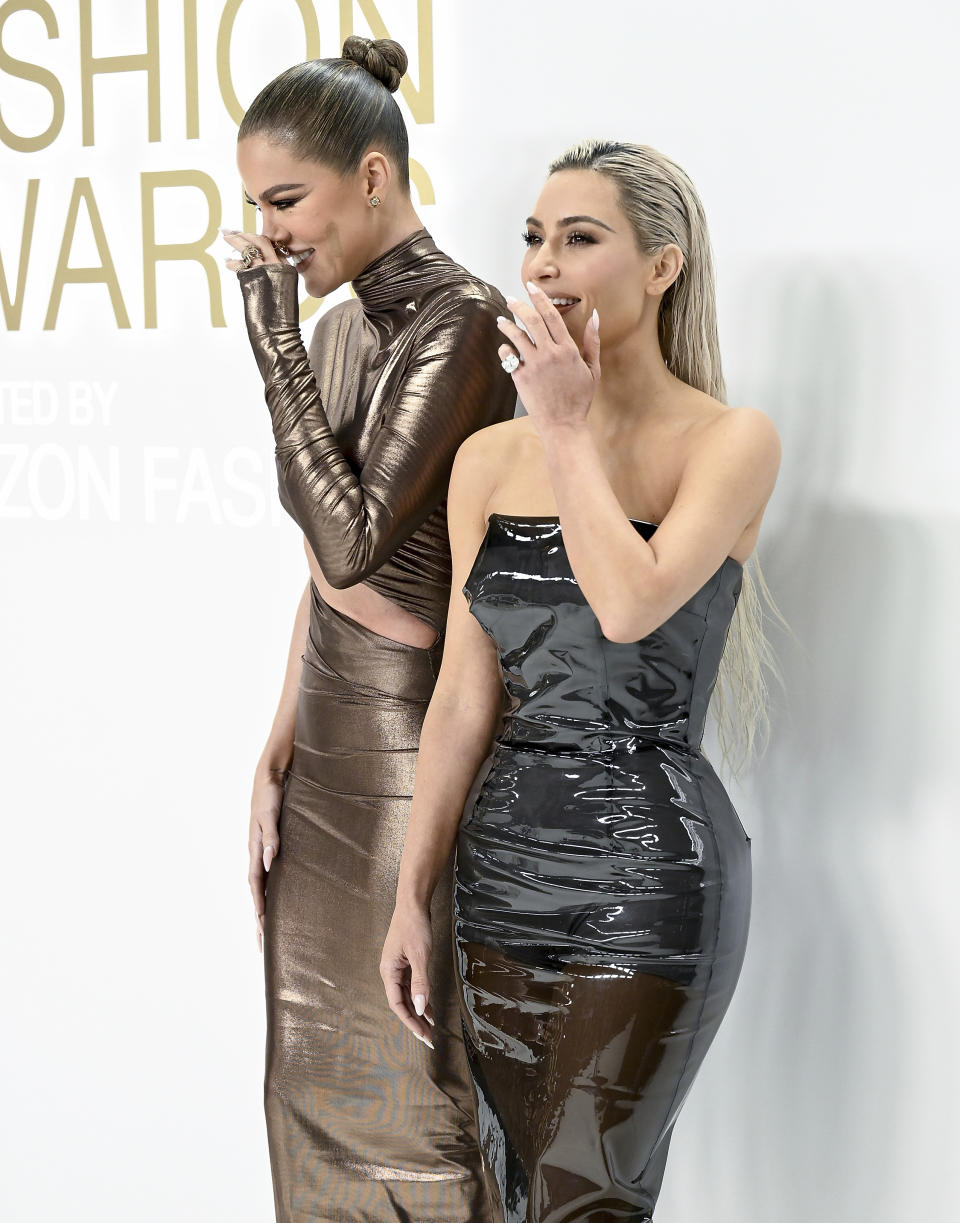 Khloe Kardashian left, and Kim Kardashian attend the CFDA Fashion Awards at Cipriani South Street on Monday, Nov. 7, 2022, in New York. (Photo by Evan Agostini/Invision/AP)