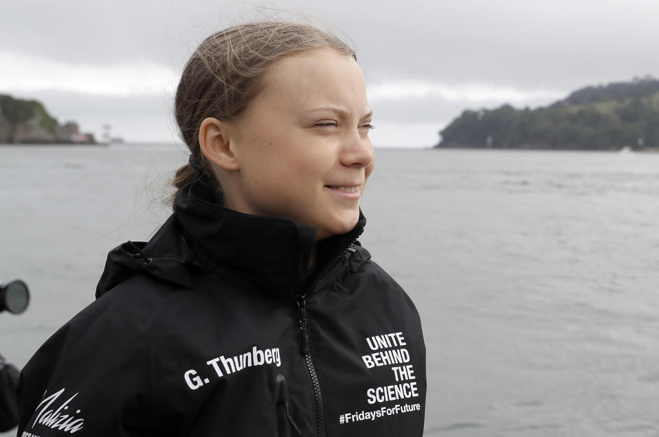 Climate change activist Greta Thunberg arrives to board the Malizia II boat in Plymouth, England, Wednesday, Aug. 14, 2019. The 16-year-old climate change activist who has inspired student protests around the world will leave Plymouth, England, bound for New York in a high-tech but low-comfort sailboat.(AP Photo/Kirsty Wigglesworth, pool)