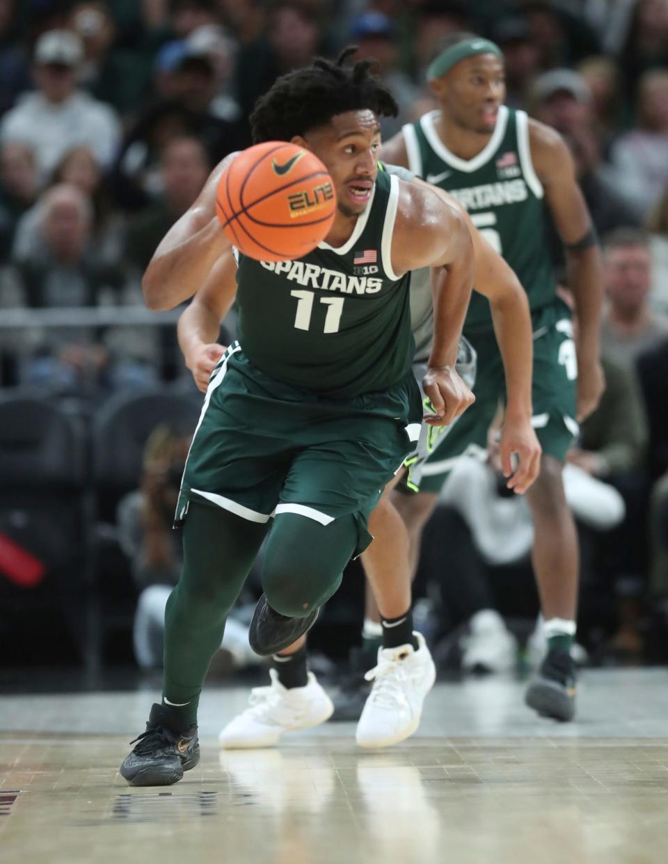 Michigan State guard A.J. Hoggard steals the ball against Baylor guard RayJ Dennis during the second half of MSU's 88-64 win over Baylor on Saturday, Dec.16, 2023, at Little Caesars Arena.