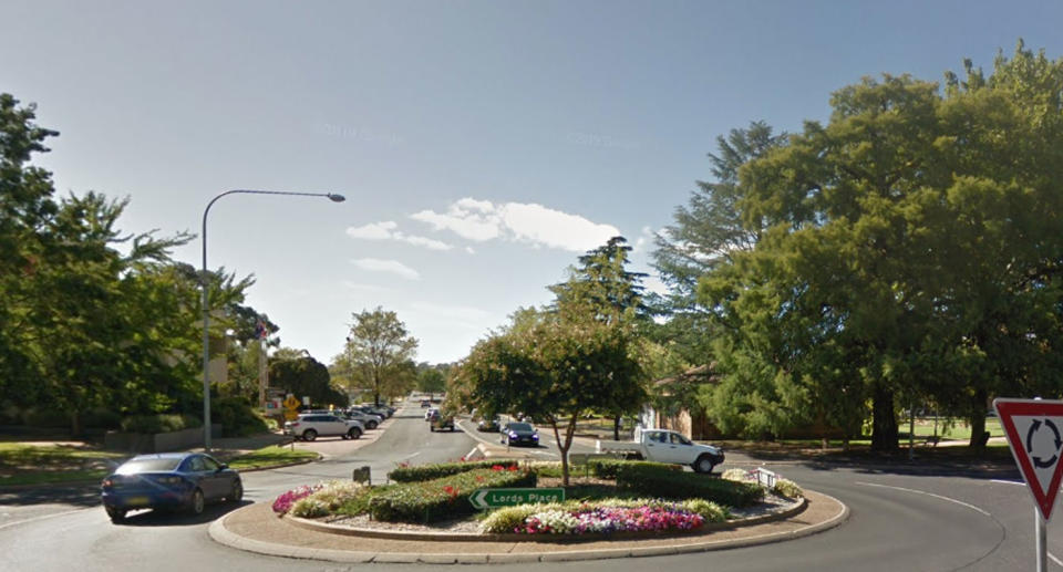 Cars using roundabout in Orange, NSW, as road rules for each state is explained.