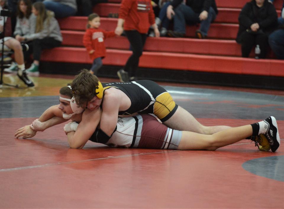 Tri-Valley's Jason Patterson controls the 157-pound match early against John Glenn's Cohen Bunting in Wednesday's MVL dual.