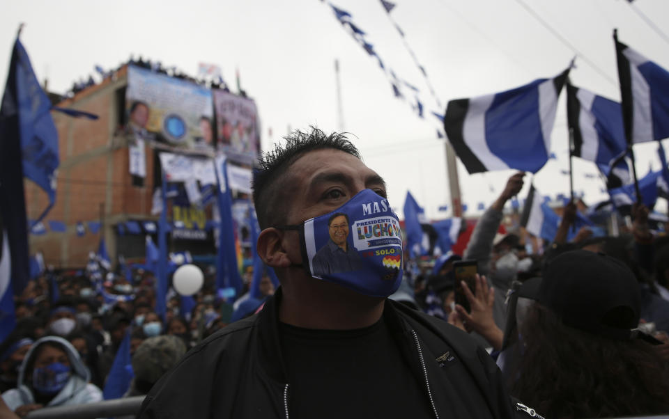 Supporters of Luis Arce, who is running for president for the Movement Towards Socialism Party, MAS, attends Arce's closing campaign rally in El Alto, Bolivia, Wednesday, Oct. 14, 2020. Elections will be held Oct. 18. (AP Photo/Juan Karita)