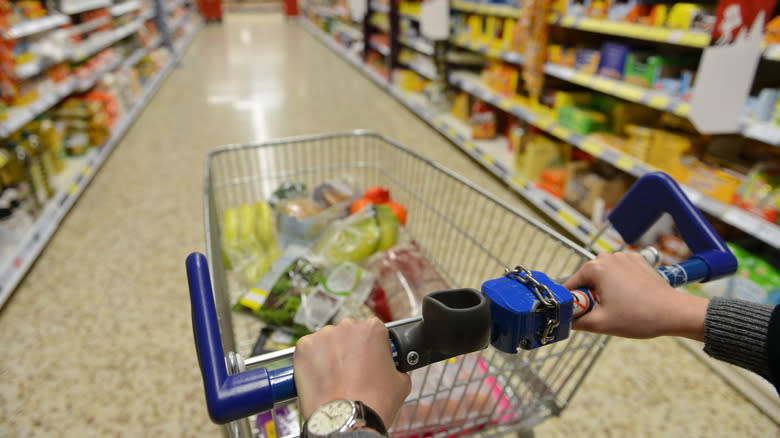 Aldi shopper pushing cart