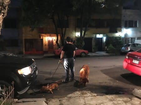 Residents react after an quake in Mexico City,