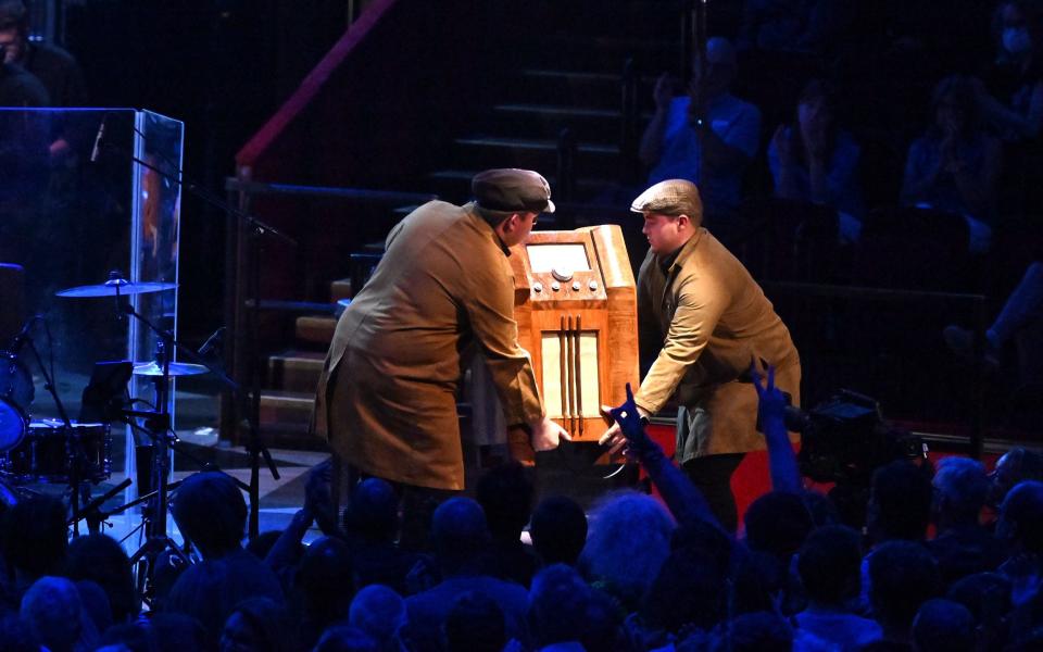 A radiogram is hauled onto stage during Prom 58 - Mark Allan