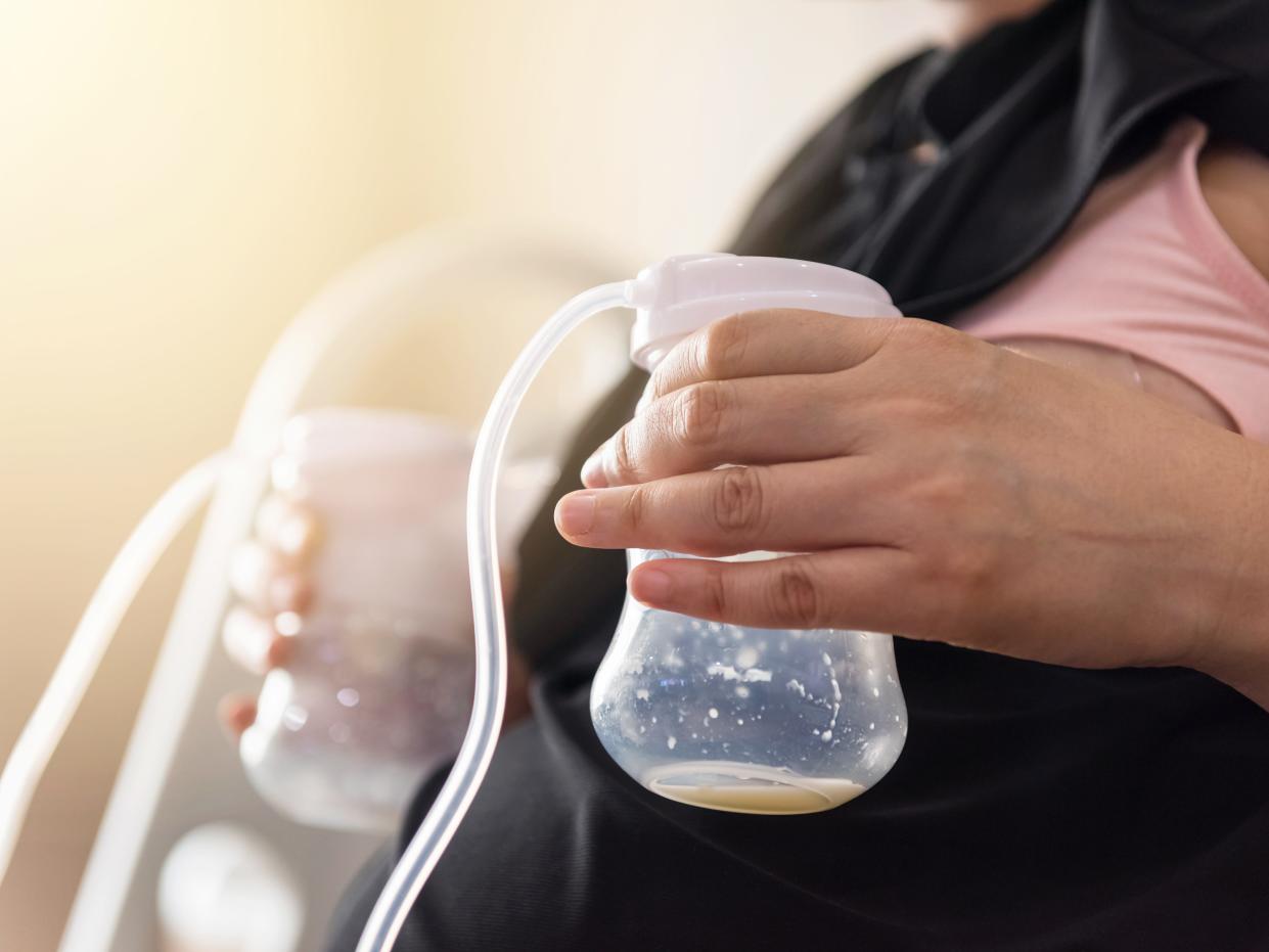 A mother is pumping breast milk.