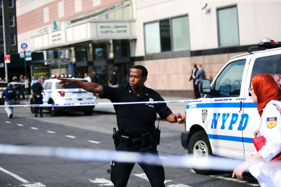 <p>A policeman directs people next to Bronx-Lebanon Hospital as they respond to an active shooter north of Manhattan in New York on June 30, 2017. (Eduardo Munoz Alvarez/AFP/Getty Images) </p>