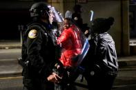 Demonstrators clash with riot police during a rally after the death of Walter Wallace Jr., a Black man who was shot by police, in Philadelphia