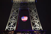 <p>The U.S. flag is projected on a giant soccer ball at the Eiffel Tower in Paris on June 13, 2016, to pay tribute to victims of a shooting inside a gay nightclub, Pulse Club in Orlando. (Photo: Chesnot/Getty Images) </p>