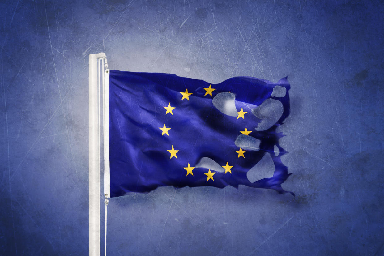 Torn European Union flag against grunge background. Photo: Getty