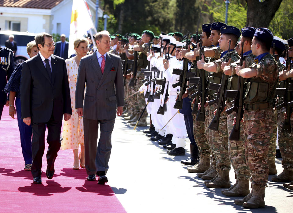 Cyprus President Nicos Anastasiades, left, and Britain's Prince Edward review a military guard of honor before their meeting at the presidential palace in the capital Nicosia, Cyprus, Tuesday, June 21, 2022. (AP Photo/Philippos Christou)