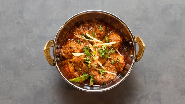 Chicken korma in metal bowl