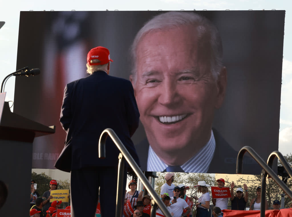  Donald Trump watches a video of President Joe Biden playing during a rally for Sen. Marco Rubio on Nov. 6, 2022. 