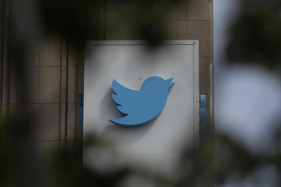 FILE - This July 9, 2019, file photo shows a sign outside of the Twitter office building in San Francisco. The Saudi government recruited two Twitter employees to get personal account information of their critics, prosecutors said Wednesday, Nov. 6, 2019. (AP Photo/Jeff Chiu, File)