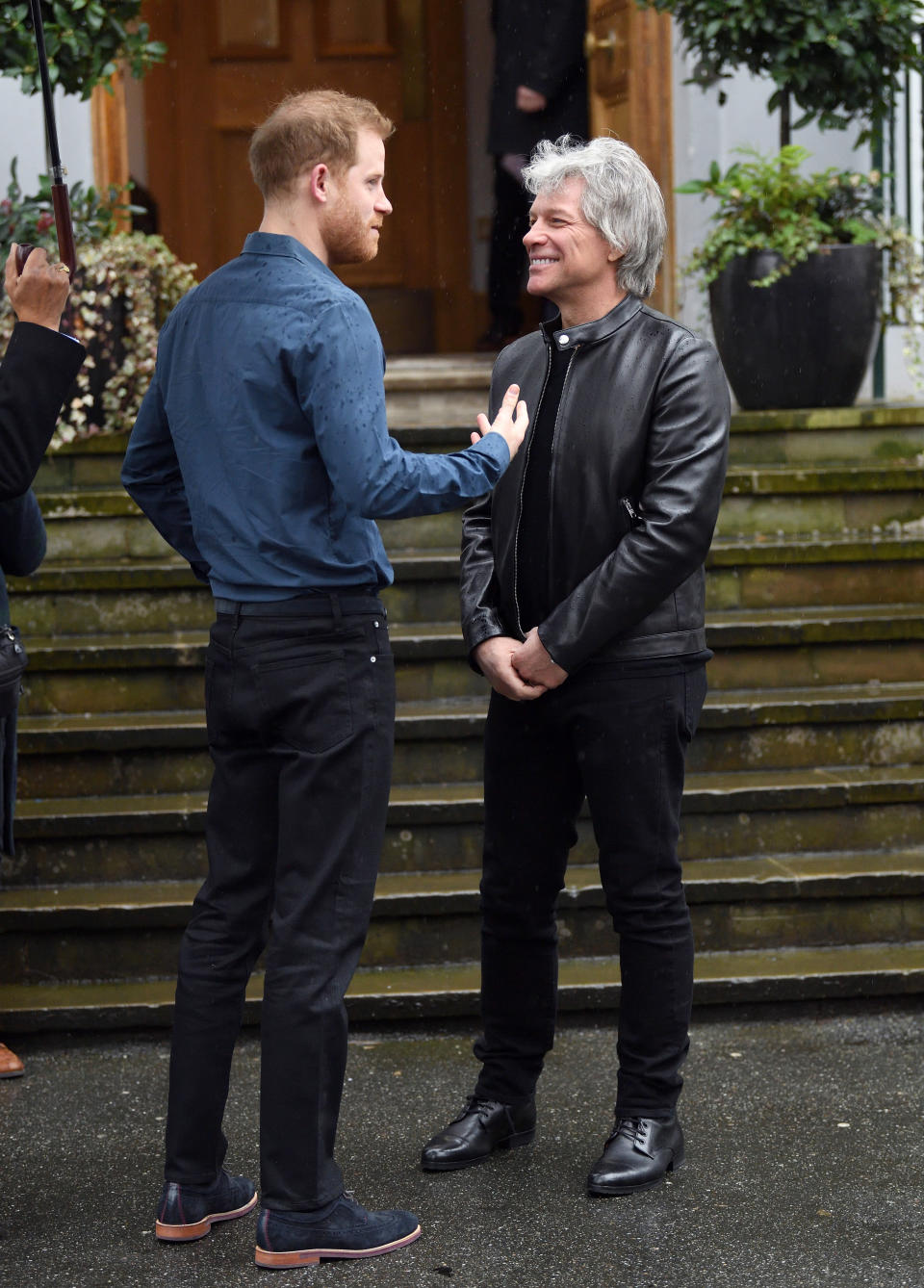 Prince Harry, Duke of Sussex and Jon Bon Jovi have a discussion outside Abbey Road Studios on February 28, 2020 in London, England.