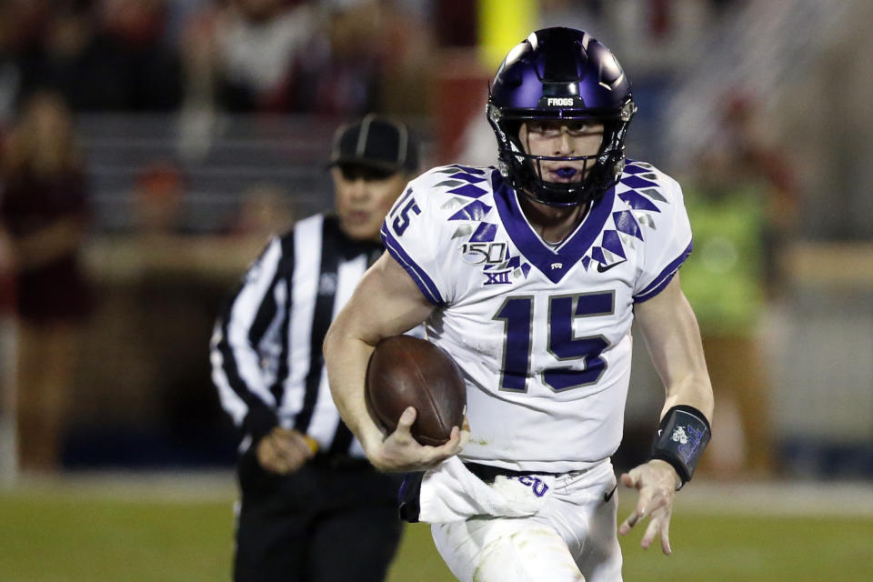 FILE - In this Nov. 23, 2019, file photo, TCU quarterback Max Duggan (15) carries the ball during an NCAA college football game against Oklahoma in Norman, Okla. Duggan could miss at least the start of the season because of a previously undetected, life-long health issue that was revealed during preseason testing and has kept him out of practice, coach Gary Patterson said Thursday, Aug. 20, 2020. (AP Photo/Sue Ogrocki, File)