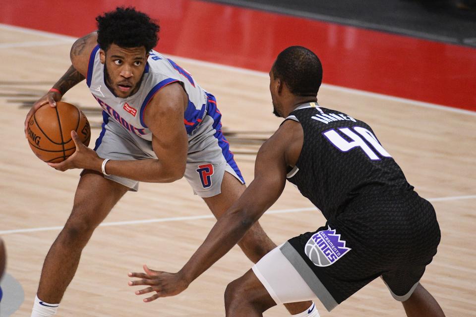 Feb 26, 2021; Detroit, Michigan, USA; Detroit Pistons forward Saddiq Bey (41) looks to pass the ball as Sacramento Kings forward Harrison Barnes (40) defends during the first quarter at Little Caesars Arena. 