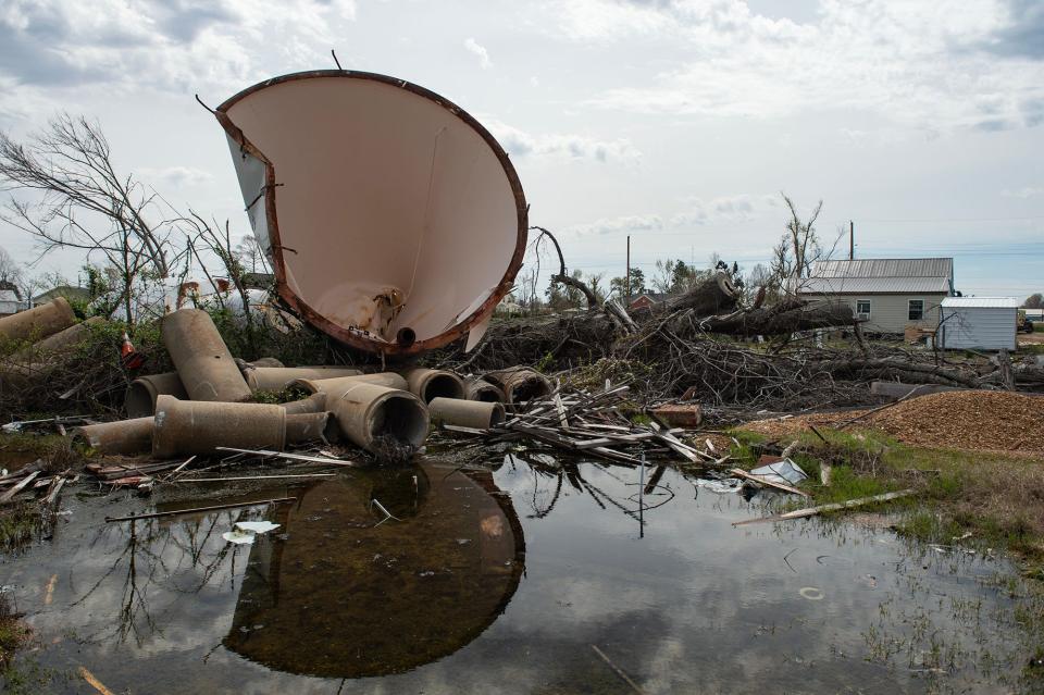 The water tower still sits in the middle of a field one year after an EF-4 tornado brought it down in Rolling Fork, Miss., seen on Wednesday, Mar. 20, 2024.