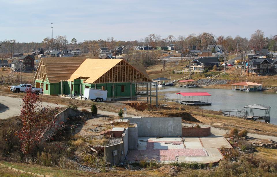 The formerly heavily-wooded area and shoreline at Kentucky Lake was changed by the December 2021 tornados in Gilbertsville, Ky. Original homes that were destroyed continue to be rebuilt.  Nov. 16, 2022.