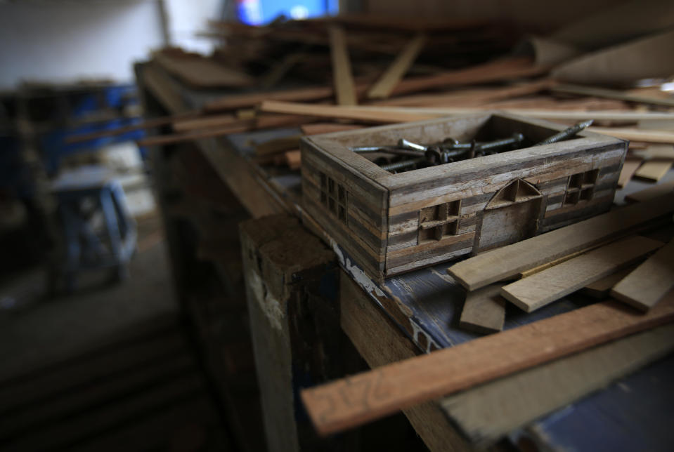 A box in the likeness of a home holds screws inside a workshop once used by prisoners to make handicrafts to sell for income, at the now closed Morelos detention center during a media tour of the former Islas Marias penal colony located off Mexico's Pacific coast, Saturday, March 16, 2019. "I think it's a pity that they have closed what could have been a model prison. They were self-supporting, they (inmates) were producing. They grew vegetables. They had cattle, goats, pigs. There was a fish farm and a salt works ... the problem was political, the authorities decided not to continue as a penal colony, and so little by little it fell apart," said Rogelio Zedillo, a former employee in the island's legal area, who is one of the believers in the penal colony. (AP Photo/Rebecca Blackwell)