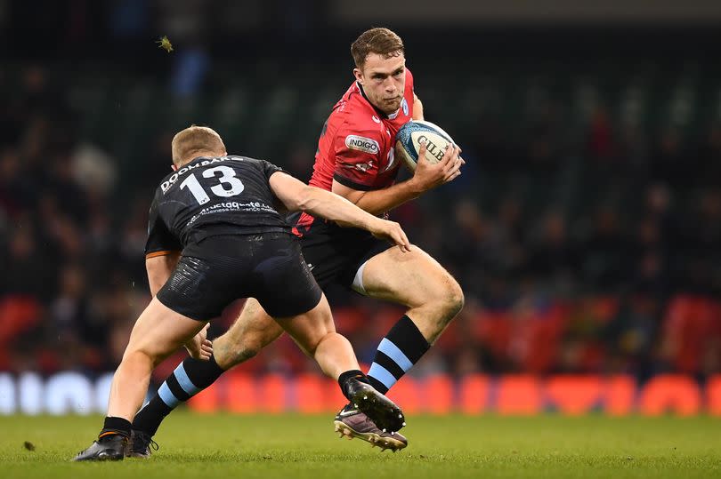 22.04.23 - Ospreys v Cardiff - United Rugby Championship - Max Llewellyn of Cardiff is tackled by Keiran Williams of Ospreys. -Credit:© Huw Evans Picture Agency