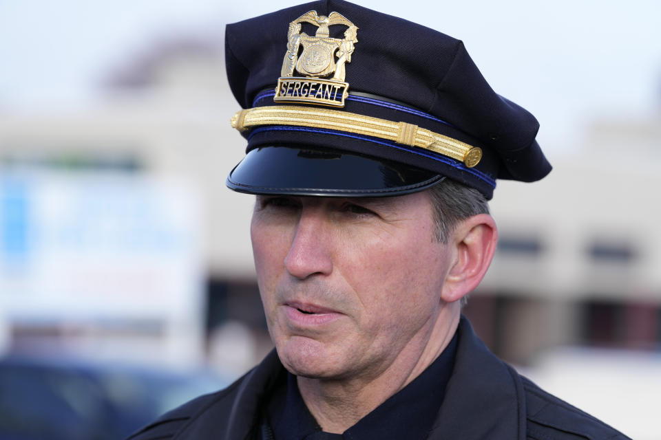 Des Moines Police spokesman Sgt. Paul Parizek speaks outside the Starts Right Here building, Monday, Jan. 23, 2023, in Des Moines, Iowa. Police say two students were killed and a teacher was injured in a shooting at the Des Moines school on the edge of the city's downtown. (AP Photo/Charlie Neibergall)