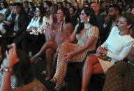 Huda Kattan, third from left, and Mona Kattan, second from right, take part at the Huda Boss on Facebook Watch screening celebration in Dubai, United Arab Emirates, Wednesday, Oct. 9, 2019. (AP Photo/Kamran Jebreili)