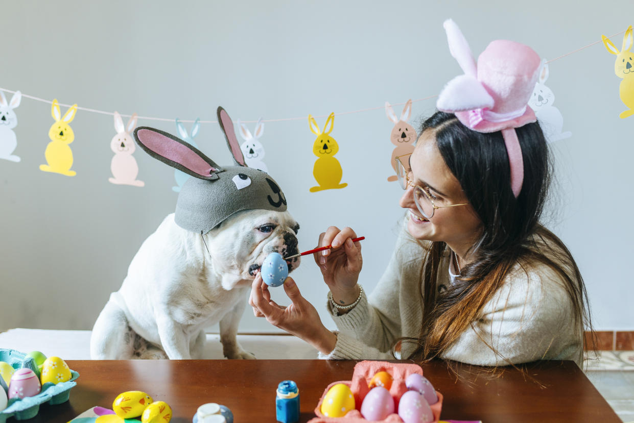 Woman celebrating Easter with her pet dog. (Getty Images)