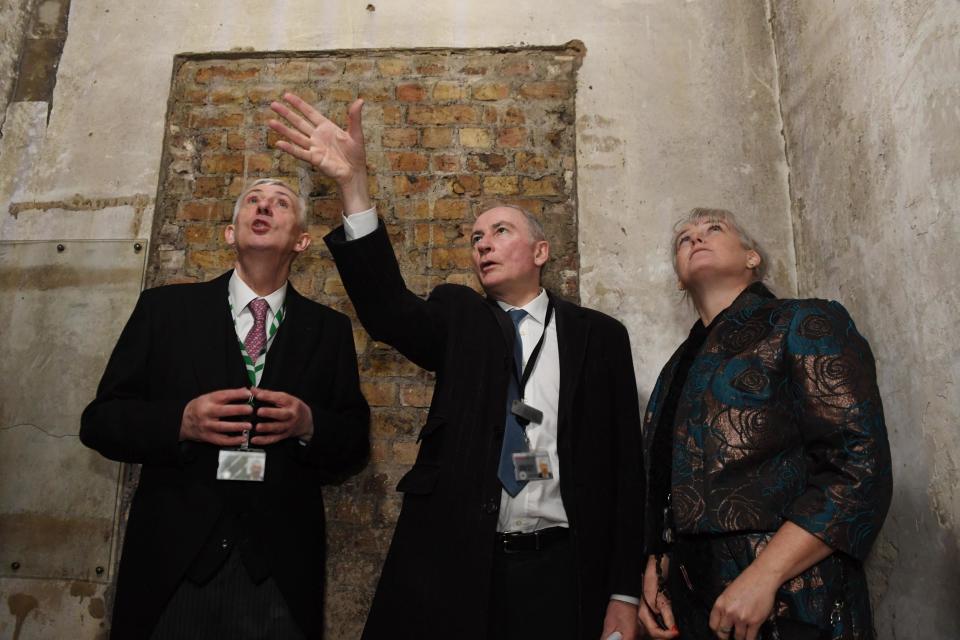 Speaker of the House of Commons Lindsay Hoyle (left) being shown a secret doorway in the House of Commons (PA)