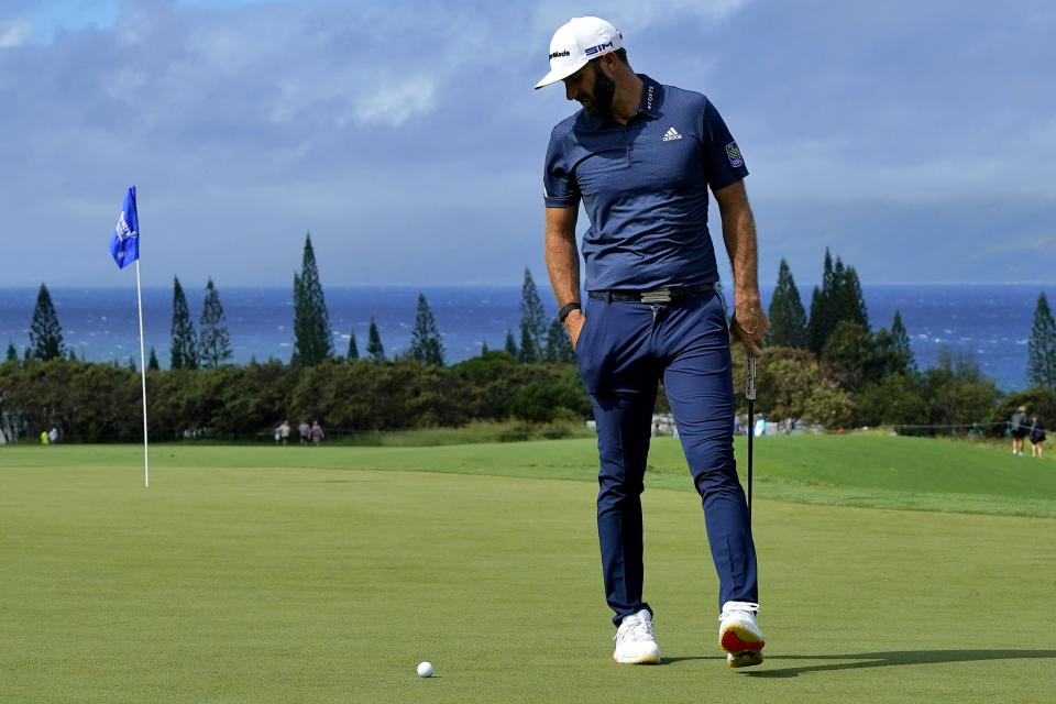 Dustin Johnson looks at his ball on the third green during second round of the Tournament of Champions golf event, Friday, Jan. 3, 2020, at Kapalua Plantation Course in Kapalua, Hawaii. (AP Photo/Matt York)