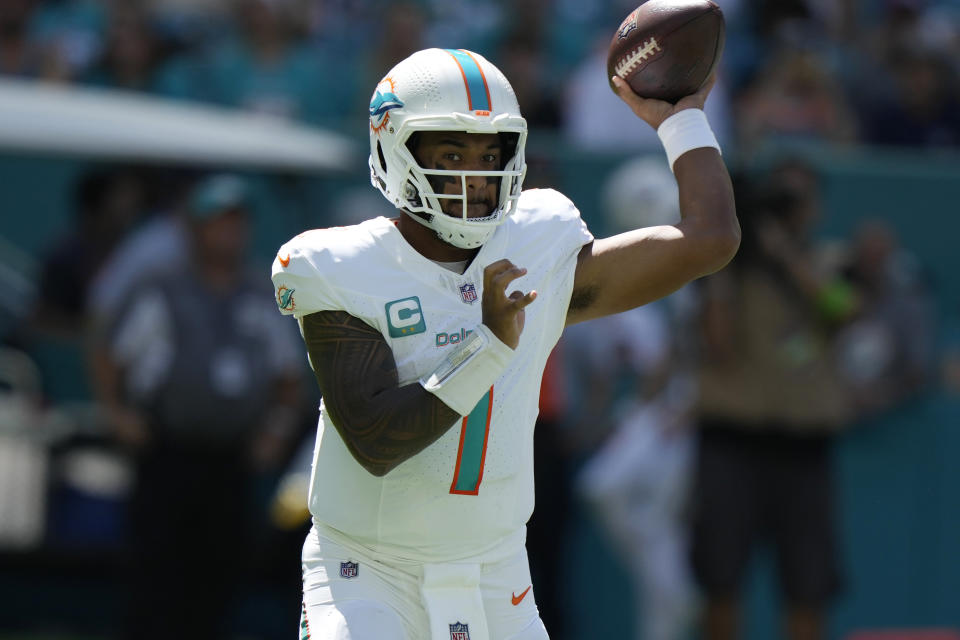 Miami Dolphins quarterback Tua Tagovailoa (1) aims a pass during the first half of an NFL football game against the Carolina Panthers, Sunday, Oct. 15, 2023, in Miami Gardens, Fla. (AP Photo/Lynne Sladky)