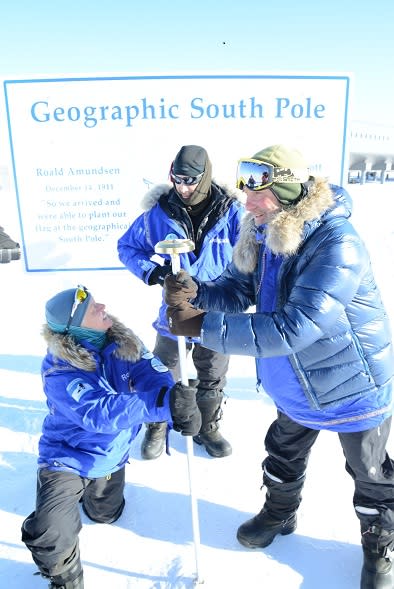 Members of the Test Your Limits team have some fun with finally reaching the South Pole.