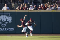 Mississippi State outfielder Rowdey Jordan, left, celebrates after catching a Notre Dame fly ball for an out while teammate Brad Cumbest, right, pumps his fist during an NCAA college baseball super regional game, Monday, June 14, 2021, in Starkville, Miss. (AP Photo/Rogelio V. Solis)