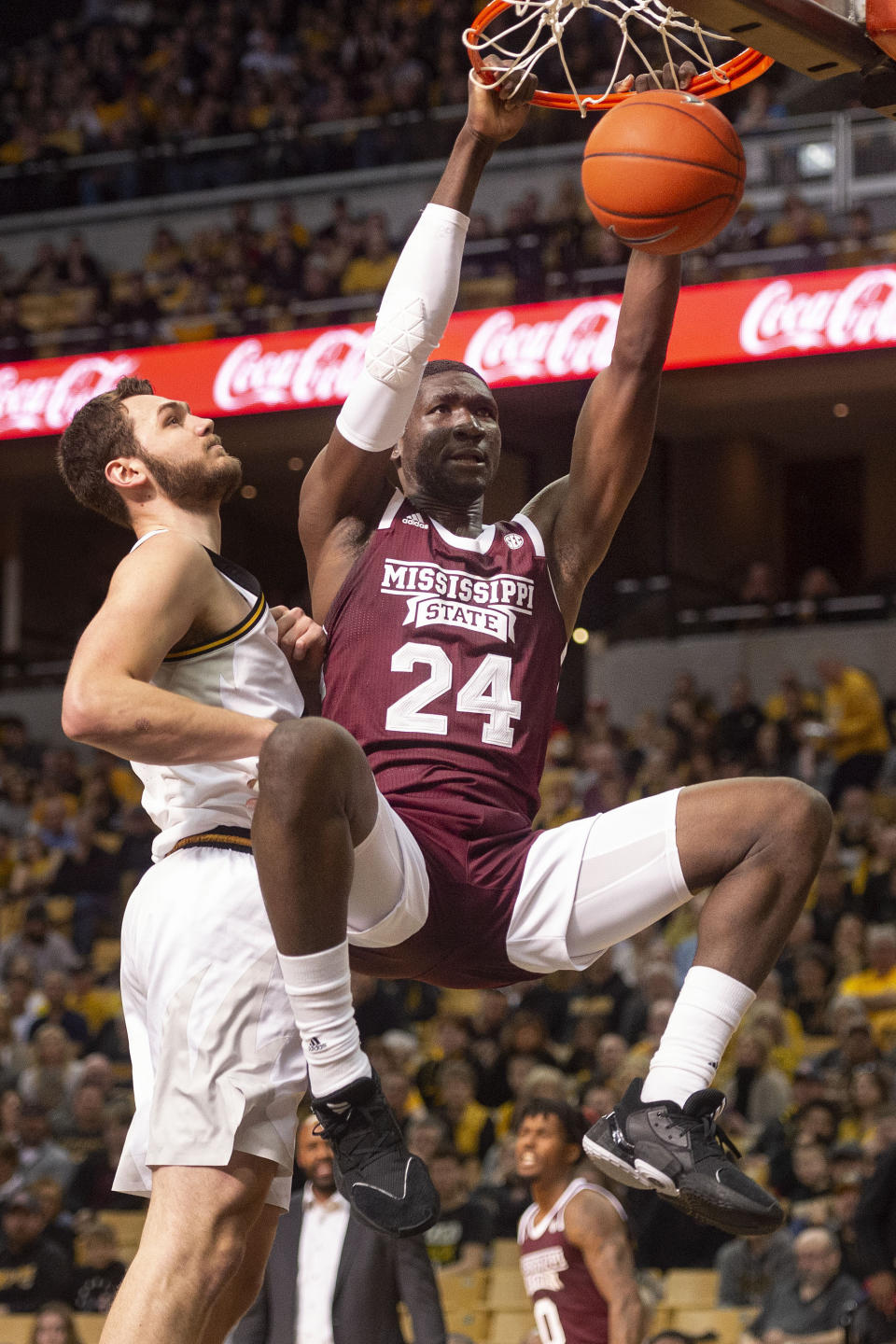 Mississippi State's Abdul Ado, right, dunks the ball past Missouri's Reed Nikko, left, during the first half of an NCAA college basketball game Saturday, Feb. 29, 2020, in Columbia, Mo. (AP Photo/L.G. Patterson)