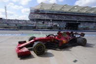 Ferrari driver Charles Leclerc, of Monaco, pulls in to the pits during a practice session for the F1 US Grand Prix auto race at the Circuit of the Americas, Friday, Oct. 22, 2021, in Austin, Texas. (AP Photo/Darron Cummings)