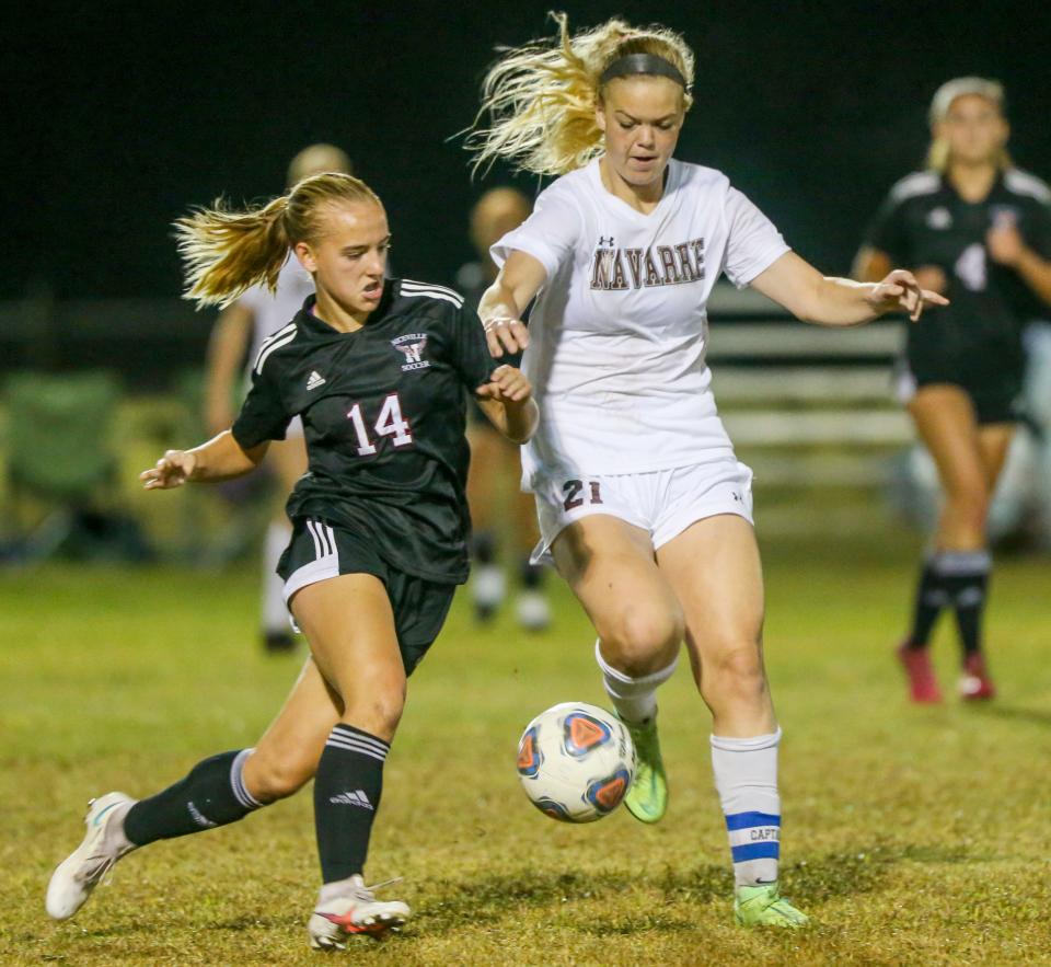 Bella Morey and Hunter Wallace attack the ball as Niceville hosted rival Navarre in a girls soccer match.